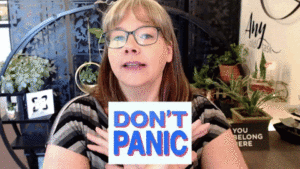 Gif of Sandra's YouTube video with the words - DON'T PANIC in front of her